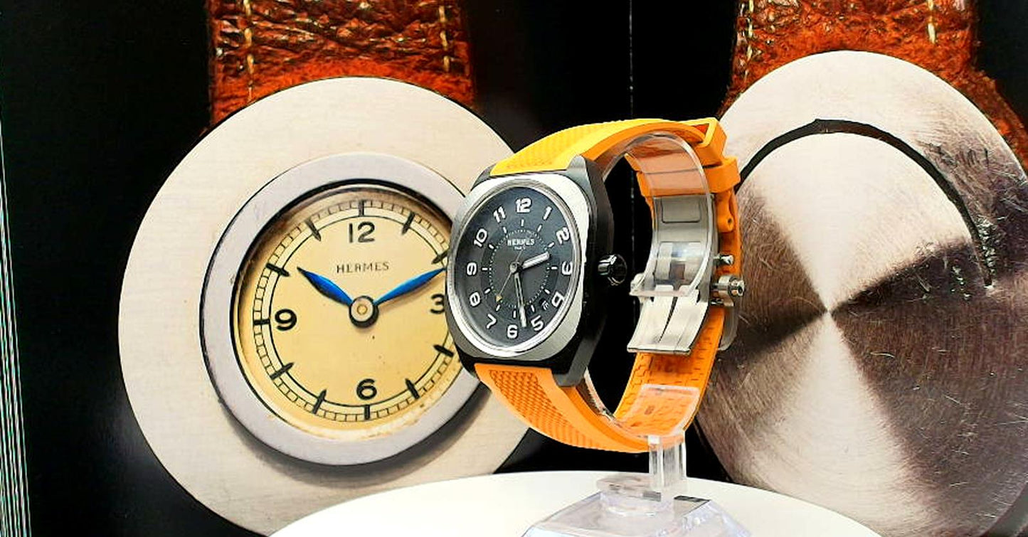 Hermes HO8 wrist watch on a rubber band.