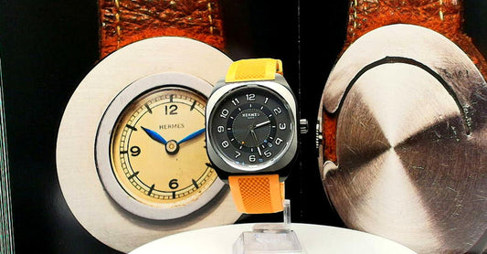 Hermes HO8 wrist watch on a rubber band.