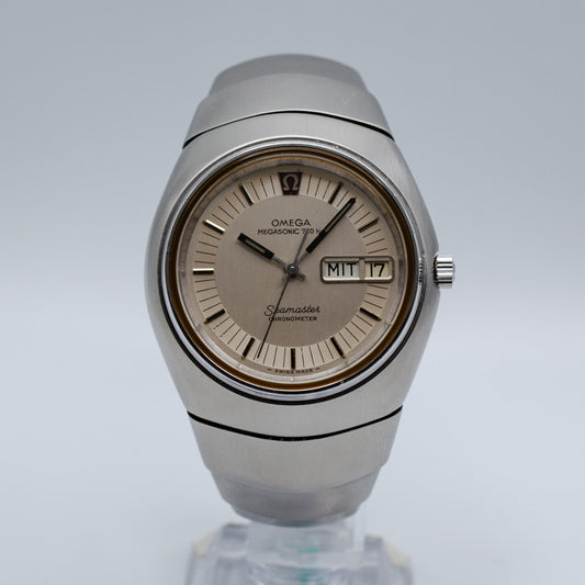 Silver Omega watch on a steel bracelet.