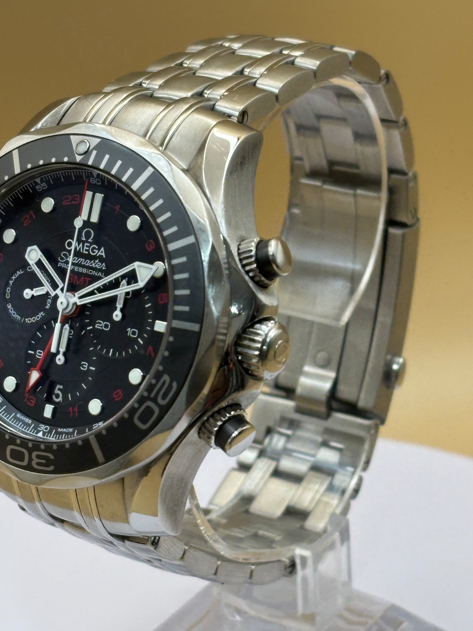 Omega Seamaster GMT Chronograph wrist watch on a steel Omega bracelet.