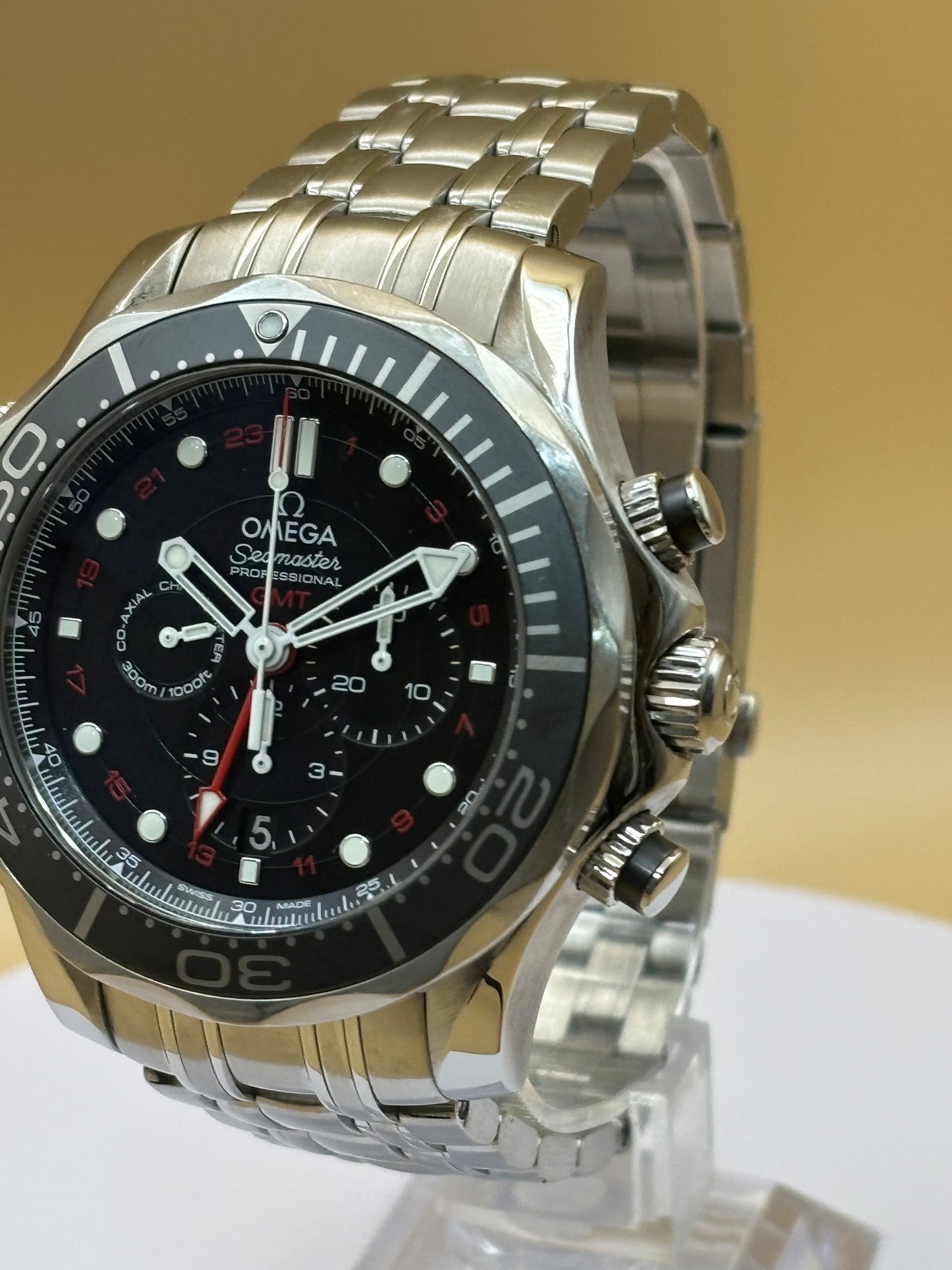 Omega Seamaster GMT Chronograph wrist watch on a steel Omega bracelet.