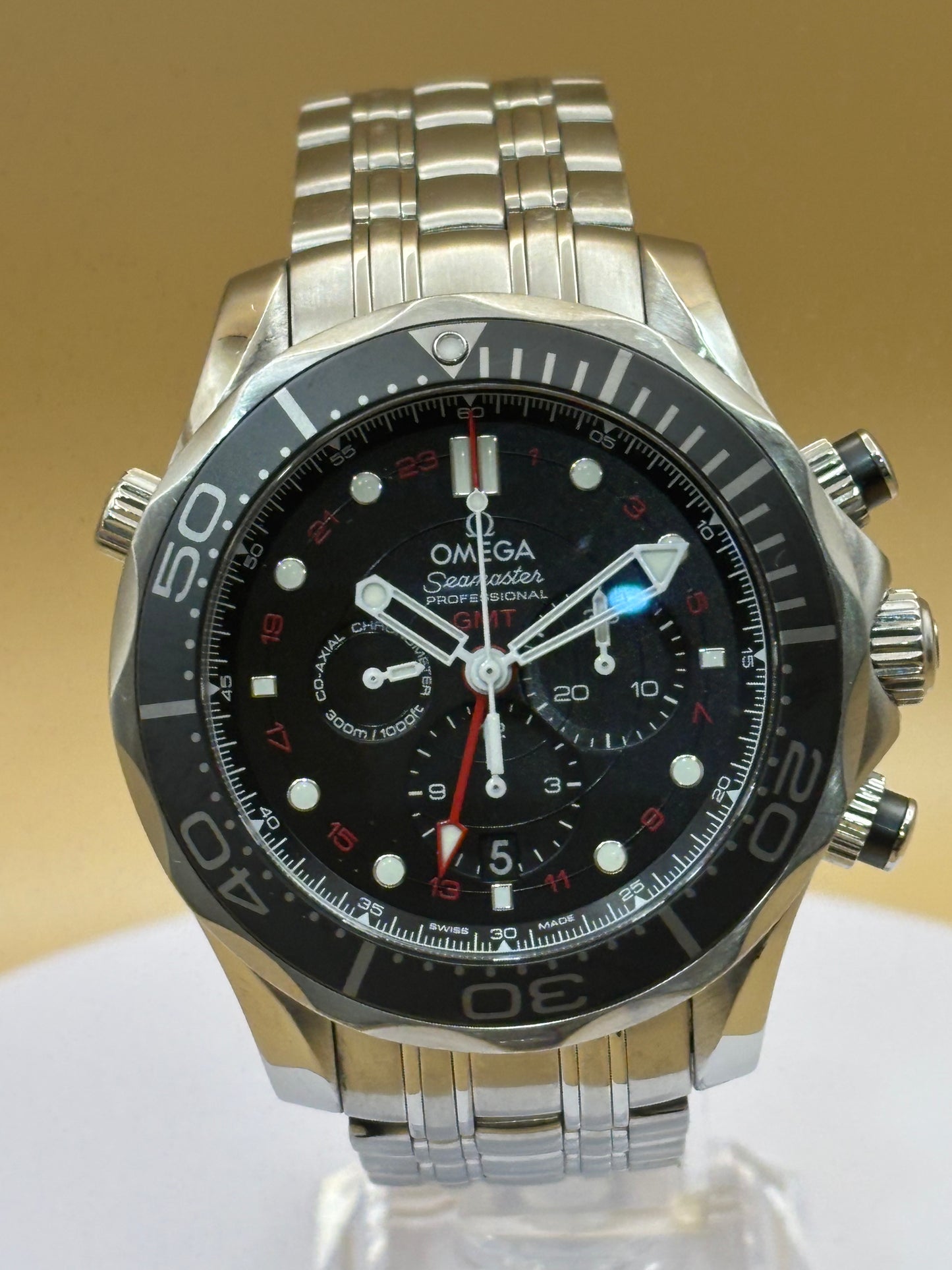 Omega Seamaster GMT Chronograph wrist watch on a steel Omega bracelet.