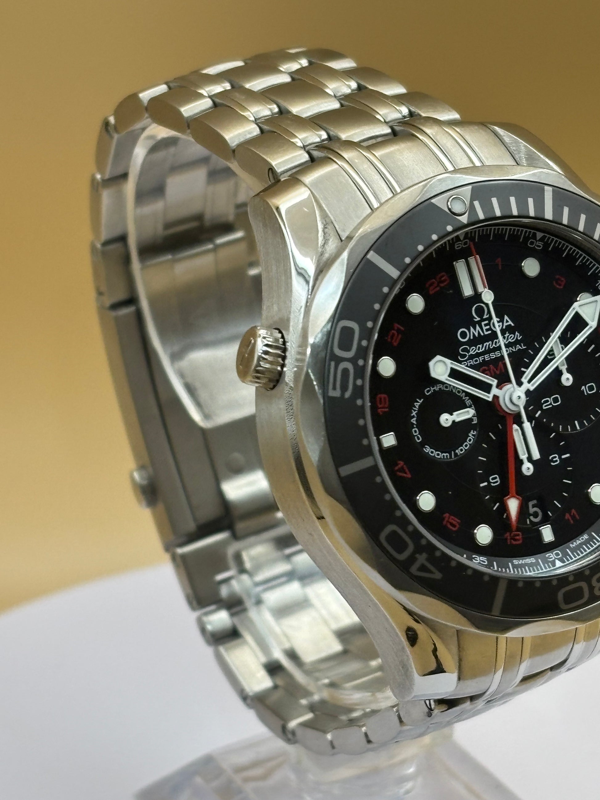 Omega Seamaster GMT Chronograph wrist watch on a steel Omega bracelet.