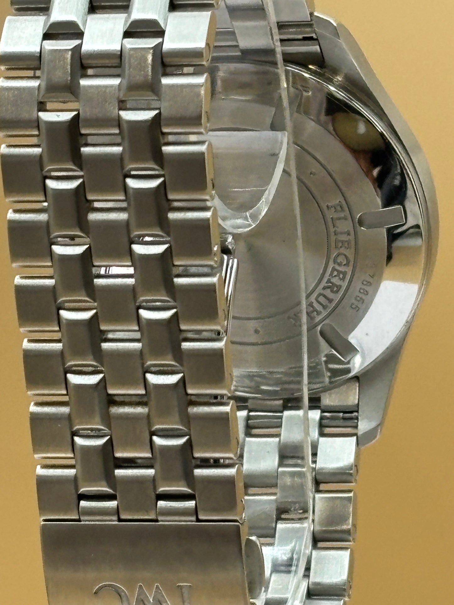 IWC Pilot Mark 16 wrist watch with a steel bracelet.