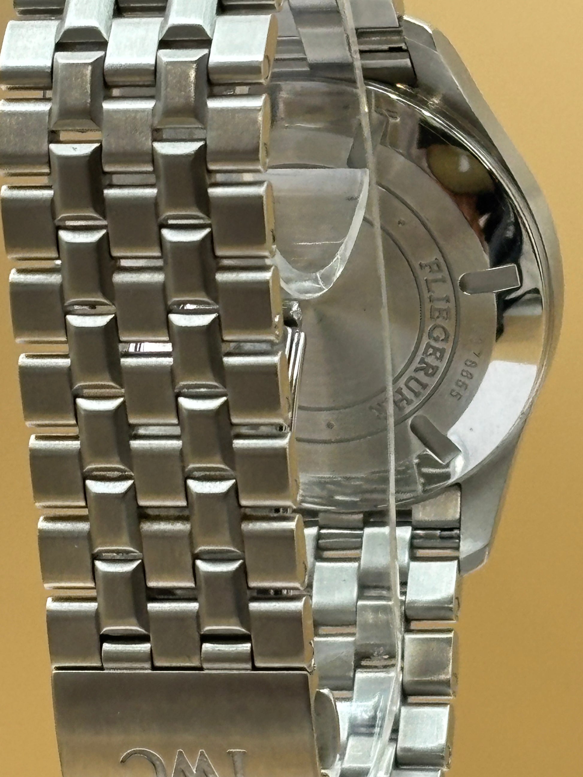 IWC Pilot Mark 16 wrist watch with a steel bracelet.