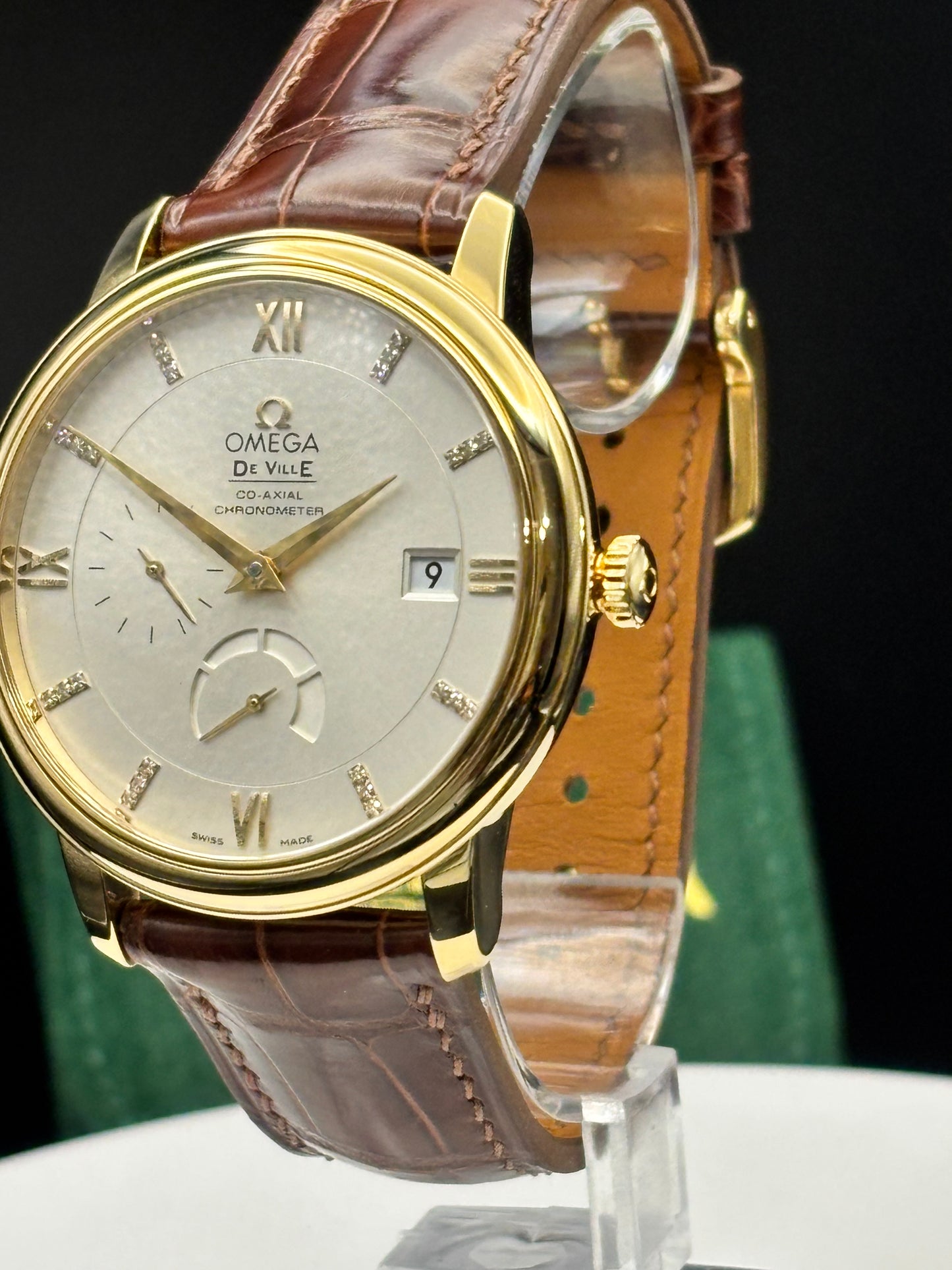 Omega De Ville Prestige 18K Solid GOLD Watch on an alligator watch.