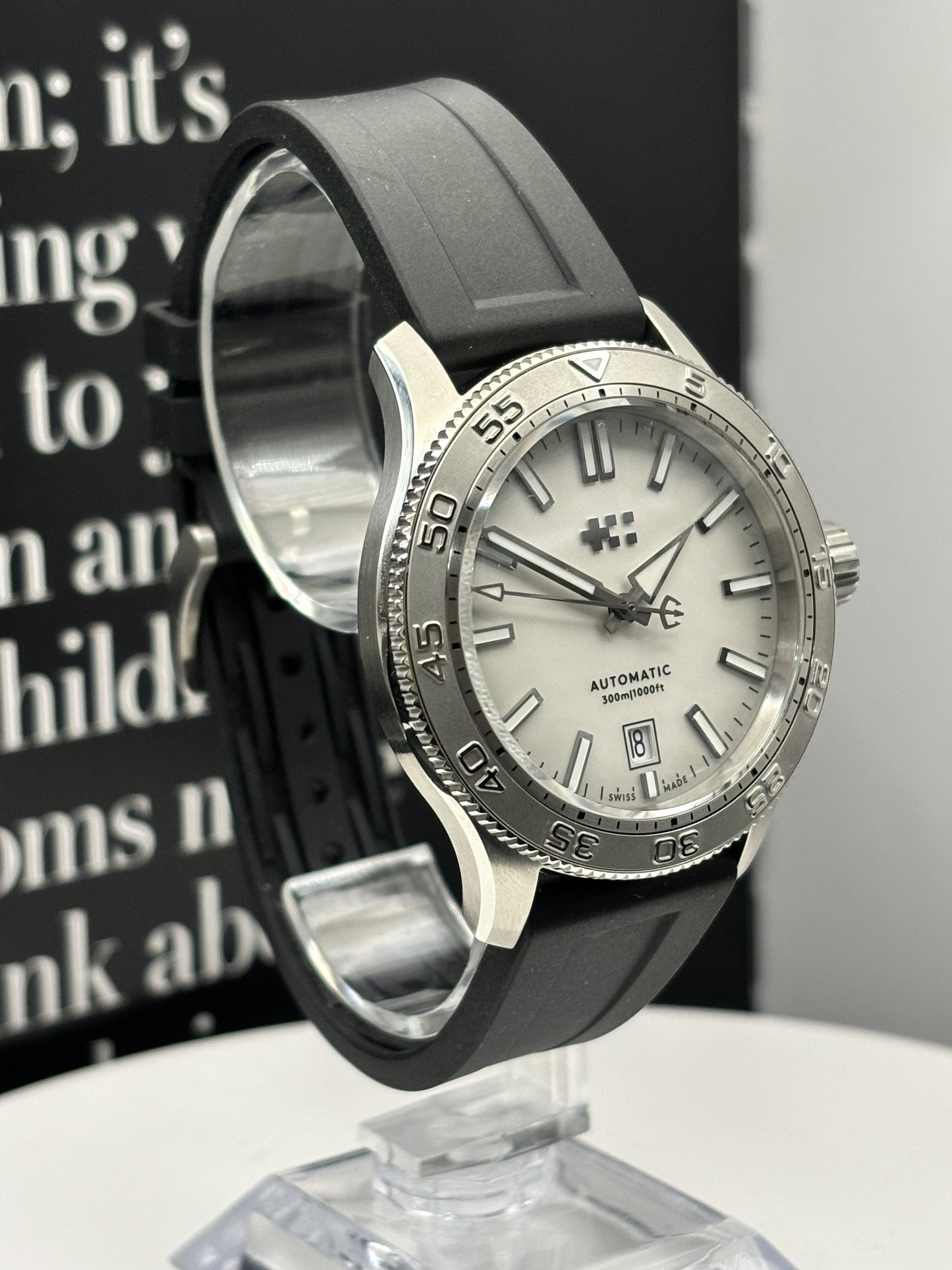 Christopher Ward C60 Atoll 300 watch on a rubber strap.