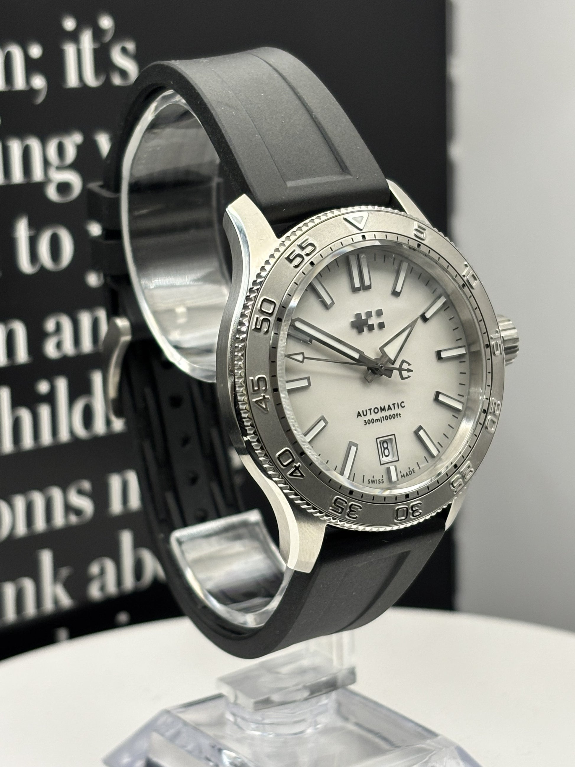 Christopher Ward C60 Atoll 300 watch on a rubber strap.