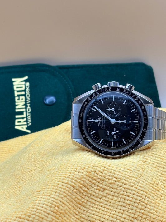Omega Speedmaster watch on a steel bracelet.