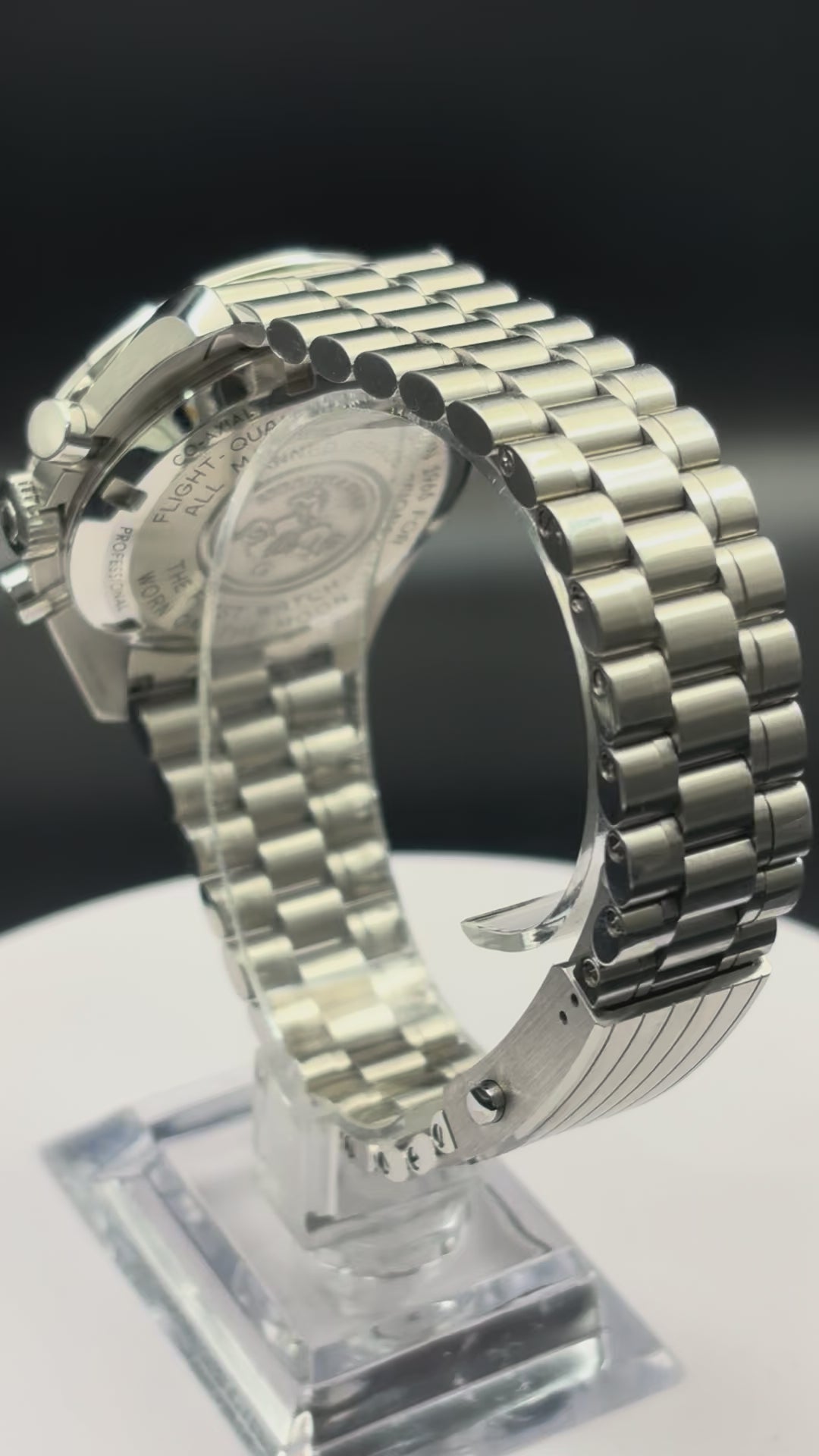 Omega Speedmaster Moonwatch on steel bracelet.